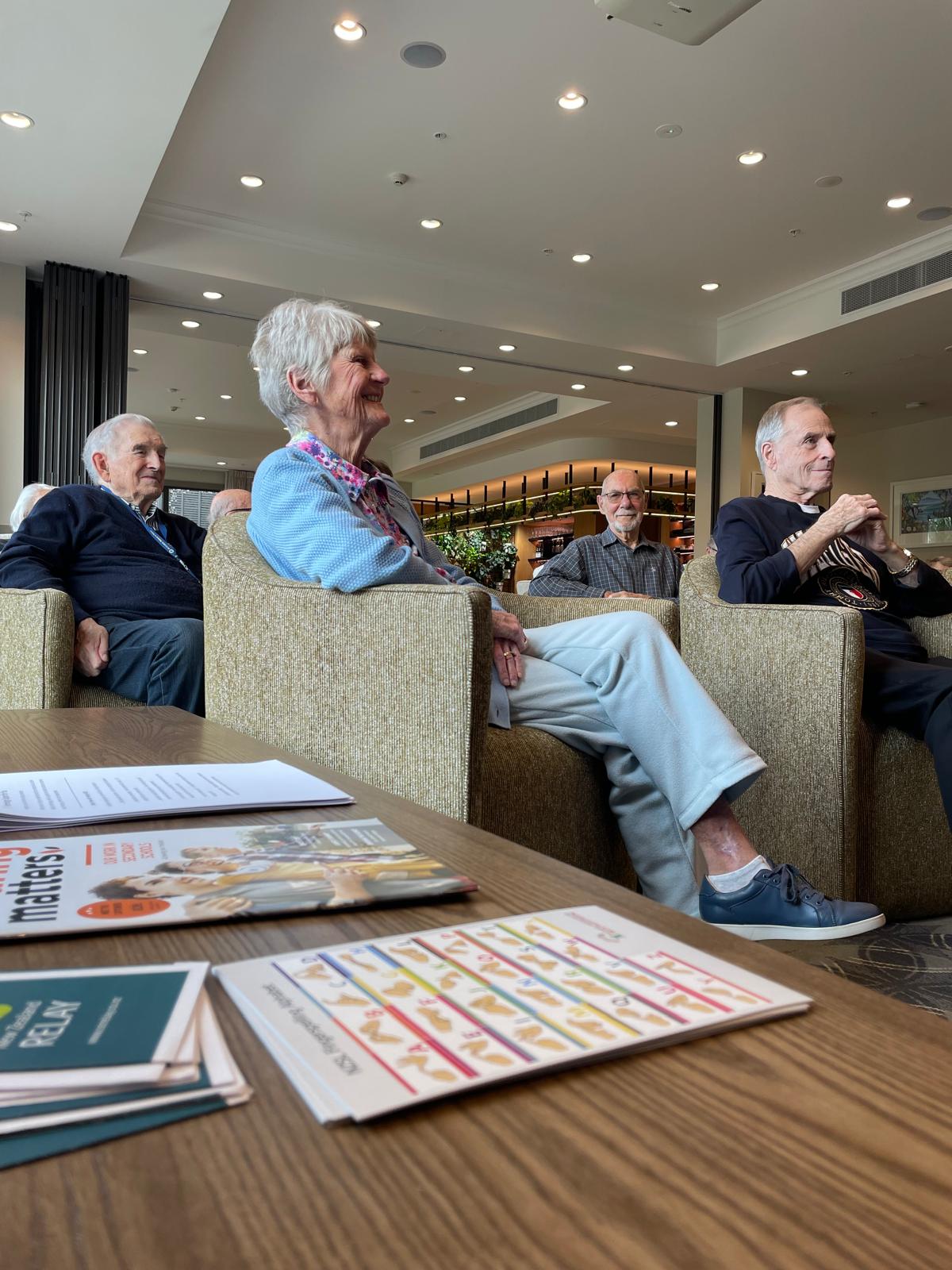 Resource display with residents in the background